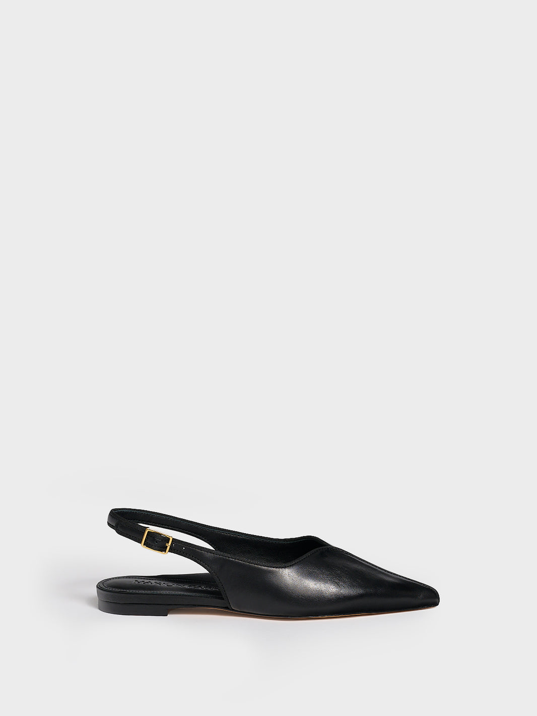 Profile view of a black leather slingback flat with a grosgrain trim detail.
