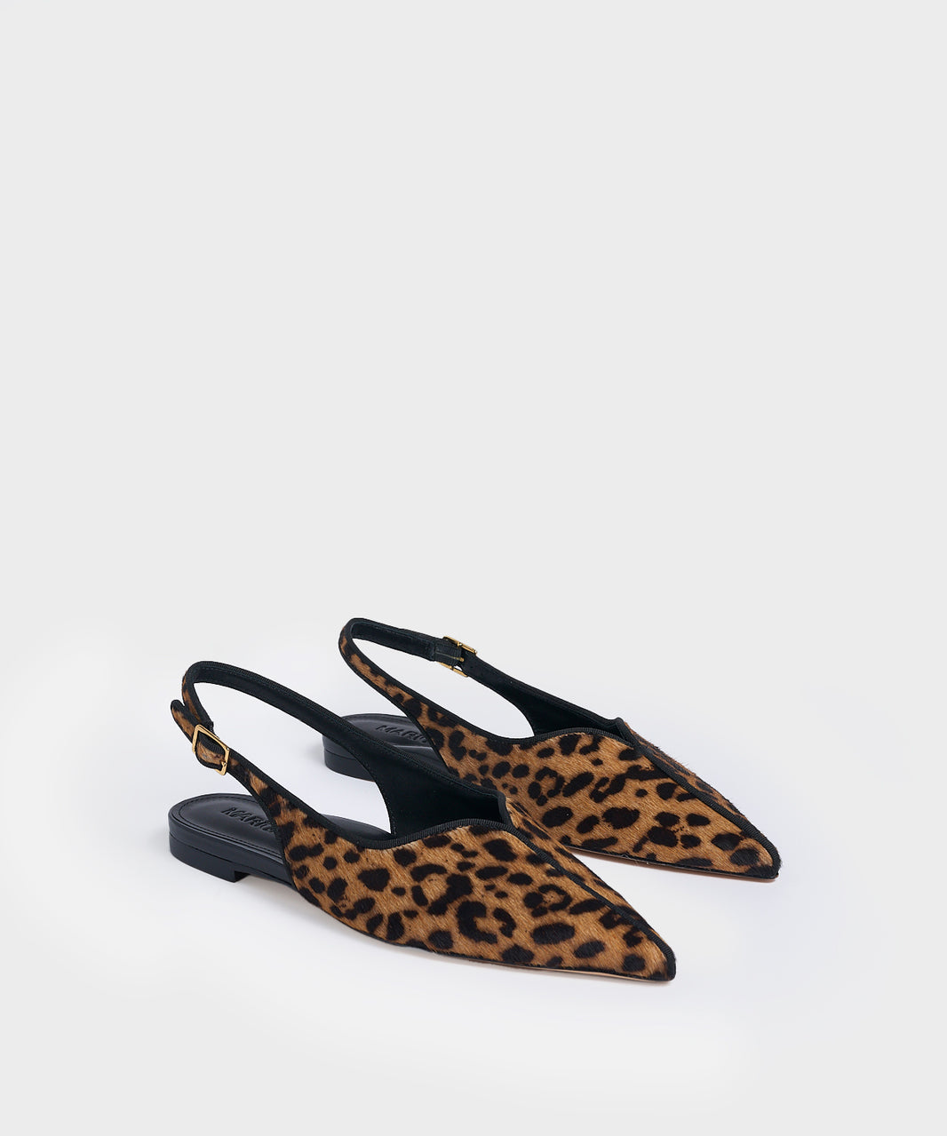 Angle view of a pair of leopard hair calf slingback flats with a grosgrain trim detail.