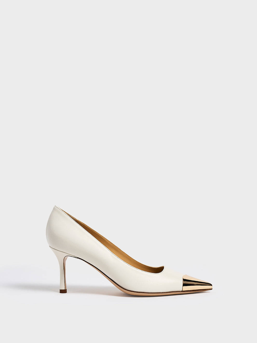 Profile view of a white leather stiletto heel pump with a gold metallic toe cap and a pointed toe.