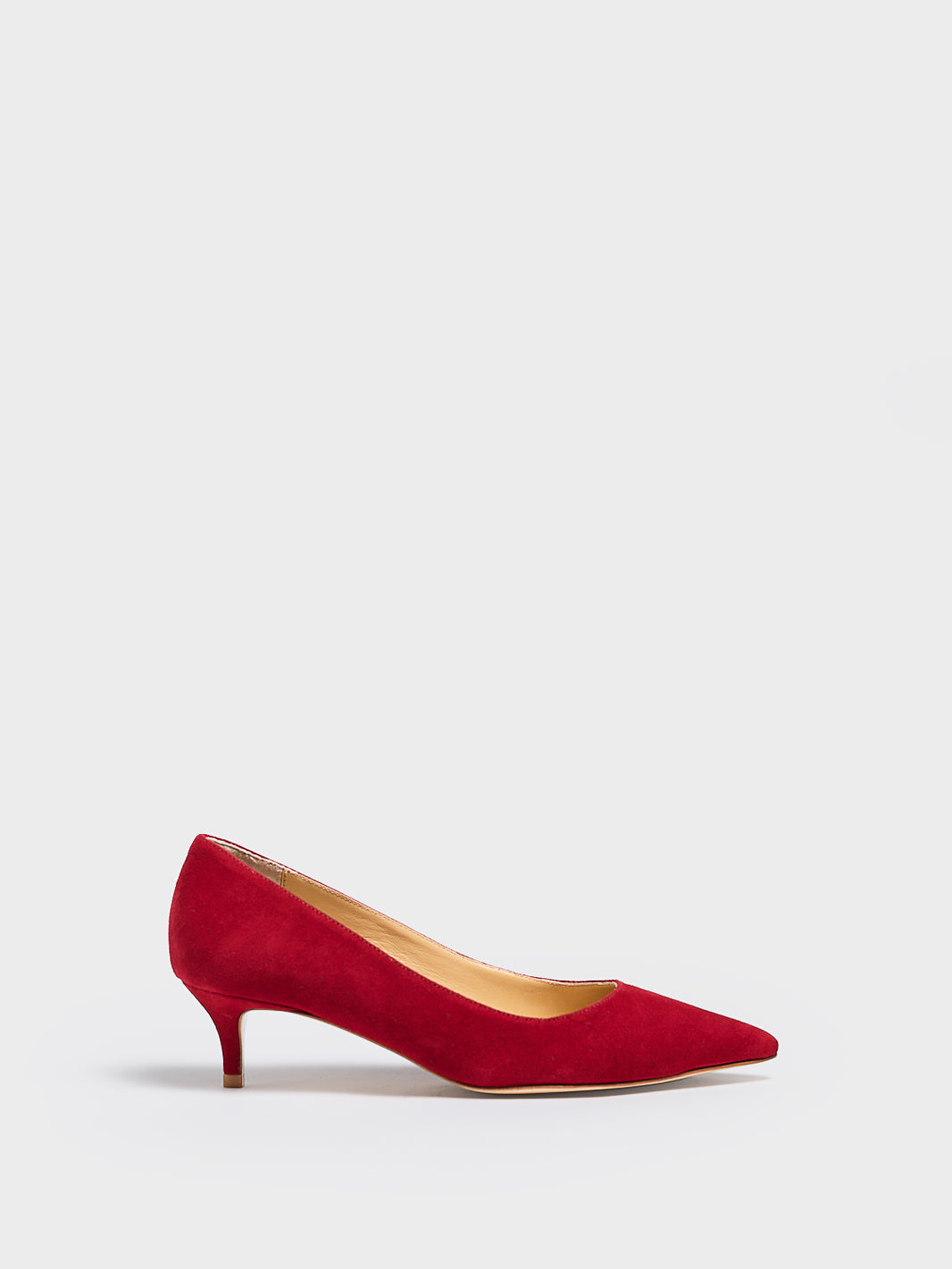 Profile view of a red suede kitten stiletto heel pump with a pointed toe.