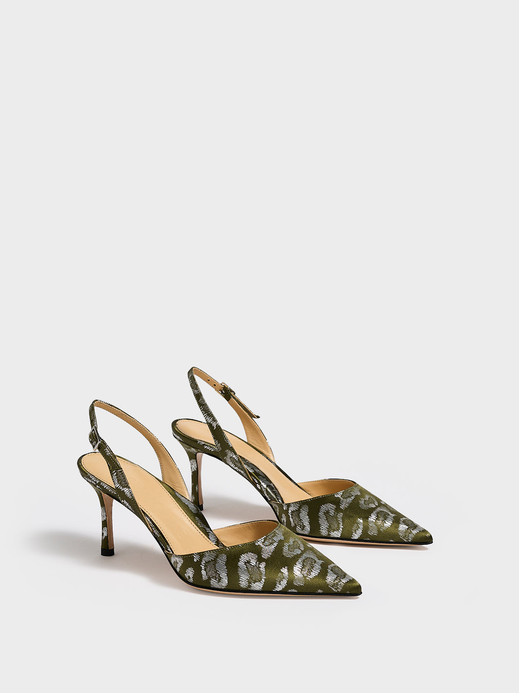 Angle view of a pair of olive green leopard silk slingback heels with a pointed toe.