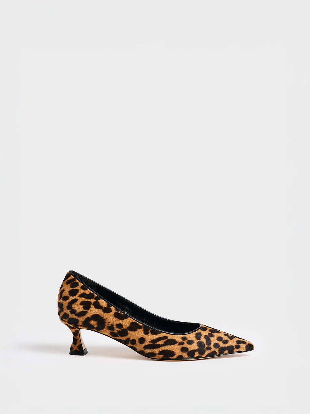 Profile view of a leopard hair calf  flared kitten heel pump with a pointed toe.